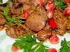 Куриная печень , тушенная в красном вине с гранатами